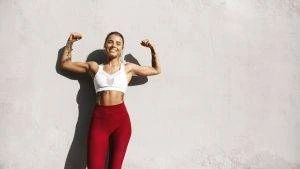 Image of a woman flexing after bicep curl exercises