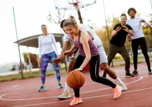 Image of gym members playing in a fundraiser basketball tournament 